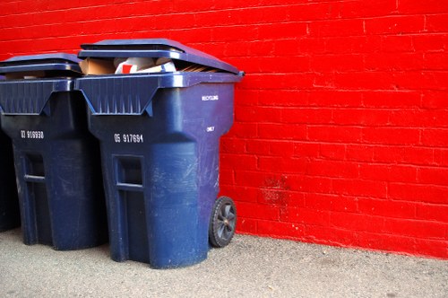 Stacked boxes and labelled recycling streams at a sustainable rubbish area