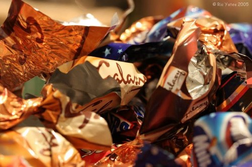 Crew carrying bulky items from a terraced house near the station